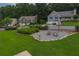 Well-maintained yard boasting a charming fire pit area, creating a cozy outdoor space for gatherings at 388 Rose Creek Pl, Woodstock, GA 30189