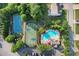 Aerial view of community amenities including pool, tennis court, and basketball court surrounded by mature trees at 109 Hale View Cir, Canton, GA 30114