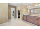 Bathroom with double sink vanity, granite countertop, and walk-in closet entrance at 109 Hale View Cir, Canton, GA 30114