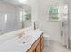 Bright bathroom with a white vanity, brushed gold faucet, and tile floors at 109 Hale View Cir, Canton, GA 30114