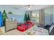 Whimsical ' room with a race car bed and custom painted mural at 109 Hale View Cir, Canton, GA 30114