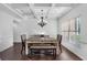 Bright dining room with coffered ceilings, hardwood floors, and a stylish table set for a delightful dining experience at 109 Hale View Cir, Canton, GA 30114