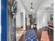 Elegant foyer with hardwood floors, an eye-catching stone fireplace, and a view of the staircase and dining area at 109 Hale View Cir, Canton, GA 30114