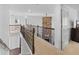 Hallway with wood railing overlooking the main floor with a stone fireplace at 109 Hale View Cir, Canton, GA 30114