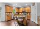 Spacious kitchen featuring wooden cabinets, stainless appliances, granite counters, and an island with seating at 109 Hale View Cir, Canton, GA 30114