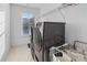 Laundry room featuring stainless steel washer and dryer with overhead storage at 109 Hale View Cir, Canton, GA 30114
