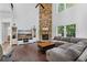 Bright living room with a stone fireplace, hardwood floors, and large windows for natural light at 109 Hale View Cir, Canton, GA 30114