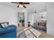 Inviting living room with cozy furniture, hardwood floors, and a glimpse into the dining area, creating an open atmosphere at 109 Hale View Cir, Canton, GA 30114
