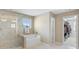 Spa-like main bathroom with a glass shower, soaking tub, and walk-in closet at 109 Hale View Cir, Canton, GA 30114