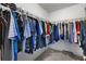 Walk-in closet featuring metal hanging racks and carpeted floor at 109 Hale View Cir, Canton, GA 30114