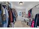 Spacious walk-in closet with ample clothing storage, vanity and seating at 109 Hale View Cir, Canton, GA 30114