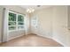 Dining area with tile flooring, large windows, and a door providing access to the outdoors at 3255 Marine Rd, Cumming, GA 30041