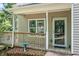 Cozy front porch with a wooden deck and railings, offering a welcoming entrance to the home at 3255 Marine Rd, Cumming, GA 30041
