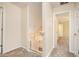 Upstairs hallway with carpeted floors and views into other rooms at 3255 Marine Rd, Cumming, GA 30041