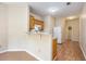 Kitchenette featuring a breakfast bar, wood cabinetry, and modern appliances for everyday convenience at 3255 Marine Rd, Cumming, GA 30041