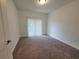 Cozy bedroom with soft carpet, neutral walls, and a large window for natural light at 525 Parkway Ne Dr # 306, Atlanta, GA 30308