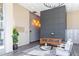 Comfortable lobby featuring a leather couch, modern art and sleek floors at 525 Parkway Ne Dr # 306, Atlanta, GA 30308