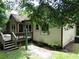 Exterior view showing the back of the house with its deck and backyard at 5820 Elm Tree Dr, Buford, GA 30518