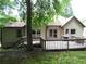 Exterior view of the back of the home, highlighting the deck and access to the yard at 5820 Elm Tree Dr, Buford, GA 30518