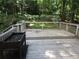 Wooden deck overlooking lush green yard at 5820 Elm Tree Dr, Buford, GA 30518