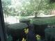 View of a lush backyard with manicured bushes and various plant life at 5820 Elm Tree Dr, Buford, GA 30518