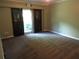 Spacious bedroom with green walls, neutral carpet, and large window at 5820 Elm Tree Dr, Buford, GA 30518