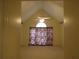 Bedroom with high ceilings, fan, and large window at 5820 Elm Tree Dr, Buford, GA 30518