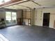 A spacious garage with built in shelving, work bench and epoxy floor for extra storage at 5820 Elm Tree Dr, Buford, GA 30518