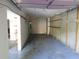 Garage interior with shelving and storage spaces ready for customization at 5820 Elm Tree Dr, Buford, GA 30518