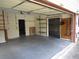 Spacious garage with multiple storage shelves and peg-board to organize your tools and accessories at 5820 Elm Tree Dr, Buford, GA 30518