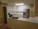 Spacious kitchen with stainless steel refrigerator and ample counter space at 5820 Elm Tree Dr, Buford, GA 30518