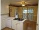 Bright kitchen with island sink and stainless faucet at 5820 Elm Tree Dr, Buford, GA 30518