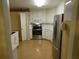 Charming kitchen with white cabinets and stainless-steel appliances at 5820 Elm Tree Dr, Buford, GA 30518