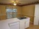 Kitchen view features stainless sink and plenty of storage at 5820 Elm Tree Dr, Buford, GA 30518