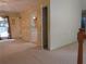 A living room area showing part of a staircase and an entrance to another room at 5820 Elm Tree Dr, Buford, GA 30518