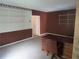 Office room with shelving and a wooden desk with a tan chair at 5820 Elm Tree Dr, Buford, GA 30518