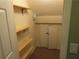 Attic storage space featuring built in shelving and additional shelving units at 5820 Elm Tree Dr, Buford, GA 30518