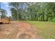 View of large back yard with deck at 2310 Whitehead Place Dr, Suwanee, GA 30024