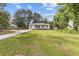 Charming single-story home featuring a lovely front porch, a well-maintained lawn and updated landscaping at 2310 Whitehead Place Dr, Suwanee, GA 30024