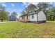 Charming single-story home featuring a lovely front porch, well-maintained lawn, and side yard at 2310 Whitehead Place Dr, Suwanee, GA 30024