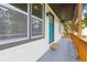 Inviting front porch with natural stone entry step, modern color scheme, and contemporary fixtures at 2310 Whitehead Place Dr, Suwanee, GA 30024