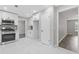 Bright kitchen features modern cabinets, stainless appliances, and marble floors at 2310 Whitehead Place Dr, Suwanee, GA 30024