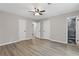 Primary bedroom with multiple closets and an ensuite bathroom at 2310 Whitehead Place Dr, Suwanee, GA 30024
