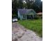 Charming bungalow-style home with a covered front porch and overgrown front yard at 3363 Lake Valley Nw Rd, Atlanta, GA 30331