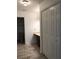 Bright bathroom featuring neutral walls, vanity with dark wood cabinets, a toilet, and double white paneled doors at 1271 Whitlock Ridge Sw Dr, Marietta, GA 30064