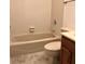 Bathroom featuring tile flooring, neutral walls, a bathtub and toilet, plus a vanity with dark wood cabinet at 1271 Whitlock Ridge Sw Dr, Marietta, GA 30064