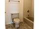 Bathroom featuring tile flooring, neutral walls and a toilet and tub at 1271 Whitlock Ridge Sw Dr, Marietta, GA 30064
