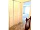 Hallway with carpet leading to a bedroom and featuring white paneled doors on either side at 1271 Whitlock Ridge Sw Dr, Marietta, GA 30064