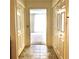 Hallway with ceramic tile flooring and double doors leading to a carpeted room at 1271 Whitlock Ridge Sw Dr, Marietta, GA 30064