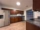 Kitchen featuring stainless steel appliances, wood cabinets, and granite countertops at 1271 Whitlock Ridge Sw Dr, Marietta, GA 30064